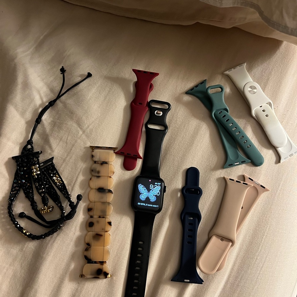 Apple Smartwatch (SE 2nd generations)  and multiple bands and charger.